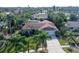 Bird's-eye view of a single story home with surrounding tropical landscape at 6549 Waterford Cir, Sarasota, FL 34238