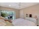 Bright bedroom with pool view, dresser, and comfortable bedding at 6549 Waterford Cir, Sarasota, FL 34238