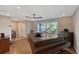 Living room with hardwood floors and large window at 6549 Waterford Cir, Sarasota, FL 34238