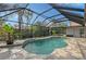 Inviting screened pool with stone tile deck at 6549 Waterford Cir, Sarasota, FL 34238