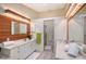 Modern bathroom with double vanity and wood feature wall at 6723 Approach Rd # 35, Sarasota, FL 34238