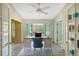 Home office with built-in shelving and access to sunroom at 6723 Approach Rd # 35, Sarasota, FL 34238