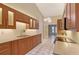 Modern kitchen with wood cabinets, stainless steel appliances, and a large island at 6723 Approach Rd # 35, Sarasota, FL 34238