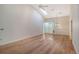 Spacious living room featuring hardwood floors and high ceilings at 6723 Approach Rd # 35, Sarasota, FL 34238