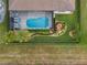 Aerial view showcasing the home's pool, landscaping, and backyard at 7139 Tamworth Pkwy, Sarasota, FL 34241
