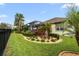Landscaped backyard with lush greenery and a relaxing atmosphere at 7139 Tamworth Pkwy, Sarasota, FL 34241