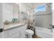 Clean bathroom with a shower/tub combo and coastal-themed shower curtain at 7139 Tamworth Pkwy, Sarasota, FL 34241