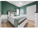 Serene bedroom featuring a white bed frame and teal accents at 7139 Tamworth Pkwy, Sarasota, FL 34241