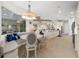 Bright breakfast nook with built-in seating and a chandelier at 7139 Tamworth Pkwy, Sarasota, FL 34241