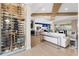 Open living space with a wine cellar and modern furniture at 7139 Tamworth Pkwy, Sarasota, FL 34241