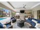 Relaxing outdoor patio with pool views and wicker furniture at 7139 Tamworth Pkwy, Sarasota, FL 34241