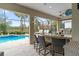 Outdoor kitchen and bar overlooking the refreshing pool at 7139 Tamworth Pkwy, Sarasota, FL 34241