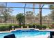 Inviting swimming pool with water feature and screened enclosure at 7139 Tamworth Pkwy, Sarasota, FL 34241