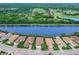 Aerial view of lakefront homes with lush landscaping at 7220 Whittlebury Trl, Lakewood Ranch, FL 34202