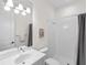 Clean bathroom with white tile shower and vanity at 7220 Whittlebury Trl, Lakewood Ranch, FL 34202