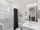 bathroom with shower/tub combo and alphabet wall art at 7220 Whittlebury Trl, Lakewood Ranch, FL 34202