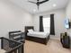 bedroom with twin bed, crib, and changing table at 7220 Whittlebury Trl, Lakewood Ranch, FL 34202