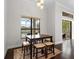 Breakfast nook with table and chairs overlooking the pool and patio at 7220 Whittlebury Trl, Lakewood Ranch, FL 34202