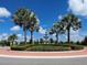Circular fountain surrounded by palm trees and landscaping at 7220 Whittlebury Trl, Lakewood Ranch, FL 34202