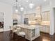 Elegant kitchen with granite countertops, custom cabinetry, and stainless steel appliances at 7220 Whittlebury Trl, Lakewood Ranch, FL 34202
