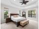 Spacious main bedroom with king-size bed and large windows at 7220 Whittlebury Trl, Lakewood Ranch, FL 34202