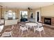 Relaxing pool area with fireplace and seating at 7220 Whittlebury Trl, Lakewood Ranch, FL 34202
