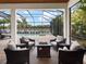 Relaxing patio with fire pit, overlooking a refreshing pool and spa at 7220 Whittlebury Trl, Lakewood Ranch, FL 34202