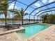 Inviting screened pool with spa and lake view at 7220 Whittlebury Trl, Lakewood Ranch, FL 34202
