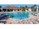 Resort-style pool with patio and grill area at 7220 Whittlebury Trl, Lakewood Ranch, FL 34202
