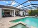 Screened pool area with outdoor kitchen and lounge at 7220 Whittlebury Trl, Lakewood Ranch, FL 34202