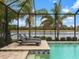 Inviting screened pool with spa and lake view at 7220 Whittlebury Trl, Lakewood Ranch, FL 34202
