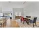 Bright dining room with glass table and modern light fixture at 7613 Camminare Dr, Sarasota, FL 34238