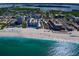 Aerial view of building, beach, and surroundings at 800 Benjamin Franklin Dr # 202, Sarasota, FL 34236