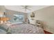 Bedroom with twin beds, dresser, and ocean view at 800 Benjamin Franklin Dr # 202, Sarasota, FL 34236