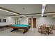Relax in the game room with pool table and seating at 800 Benjamin Franklin Dr # 202, Sarasota, FL 34236