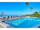 Relaxing oceanfront pool with ample lounge chairs at 800 Benjamin Franklin Dr # 202, Sarasota, FL 34236