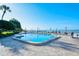 Community pool with oceanfront views and lounge chairs at 800 Benjamin Franklin Dr # 202, Sarasota, FL 34236