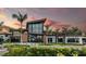 Modern community center with glass facade and palm trees at 8024 Moonbeam Ave, Sarasota, FL 34241