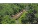 Nature trail with a wooden boardwalk path through lush greenery at 8024 Moonbeam Ave, Sarasota, FL 34241