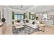 Bright and airy living room with comfortable seating and large windows at 8040 Moonbeam Avenue, Sarasota, FL 34241