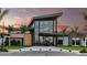 Modern community clubhouse with welcoming entrance and landscaping at 8053 Moonbeam Ave, Sarasota, FL 34241