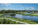 Community features a lake, walking paths, and clubhouse at 8125 Moonbeam Ave, Sarasota, FL 34241