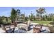 Relaxing fire pit area with wooden chairs for outdoor gatherings at 8125 Moonbeam Ave, Sarasota, FL 34241