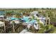 Relaxing community pool with plenty of lounge chairs and shade structures at 8125 Moonbeam Ave, Sarasota, FL 34241