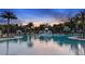 Relaxing pool area with water features and cabanas at 8125 Moonbeam Ave, Sarasota, FL 34241