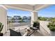 Relaxing balcony with outdoor furniture and neighborhood views at 8273 Shooting Star Rd, Sarasota, FL 34241