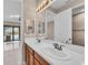 Double vanity bathroom with modern fixtures and elegant tile at 8273 Shooting Star Rd, Sarasota, FL 34241