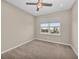 Bright bedroom with neutral walls and carpeting at 8273 Shooting Star Rd, Sarasota, FL 34241