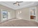 Bright bedroom with private access to the bathroom and balcony at 8273 Shooting Star Rd, Sarasota, FL 34241