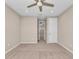Spacious bedroom with carpeted floor and ceiling fan at 8273 Shooting Star Rd, Sarasota, FL 34241